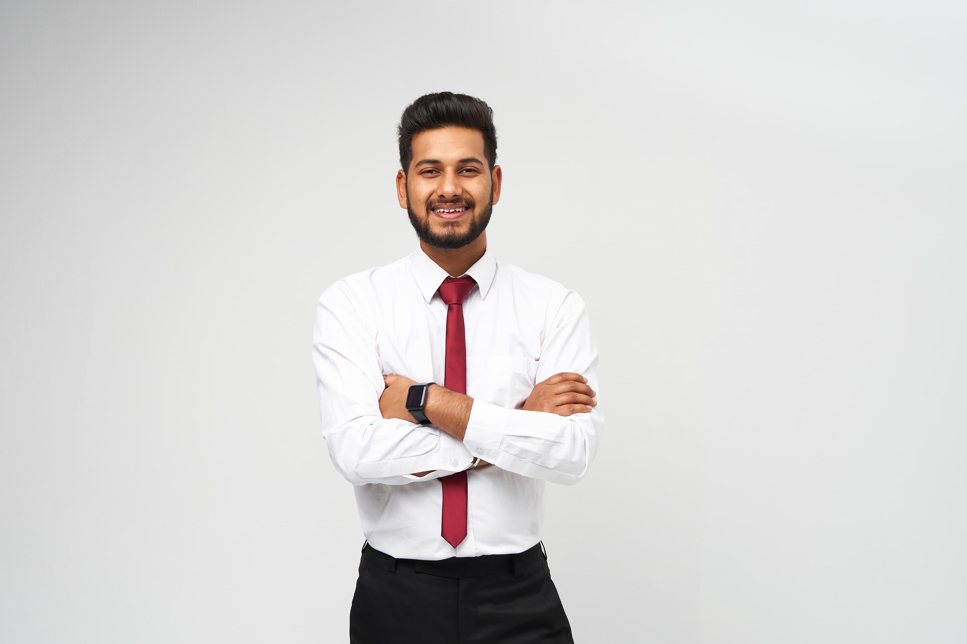 A smiling candidate holding a laptop after landing a job
